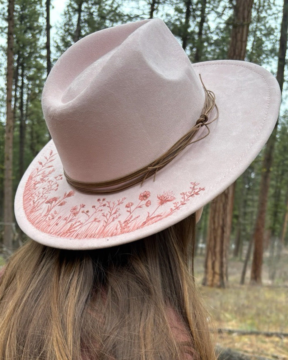 Intricate, full-brim hand-etched wildflower design on a wide-brim felt hat. Chaotic and beautiful floral wood-burn art featuring mountain flora and untamed blossoms.